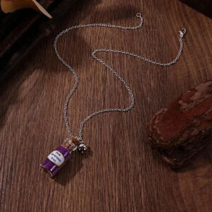 Glass bottle purple grains poor unfortunate souls Ursula cauldron charm necklace